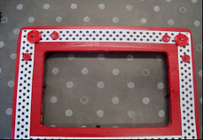 picture frame with red buttons